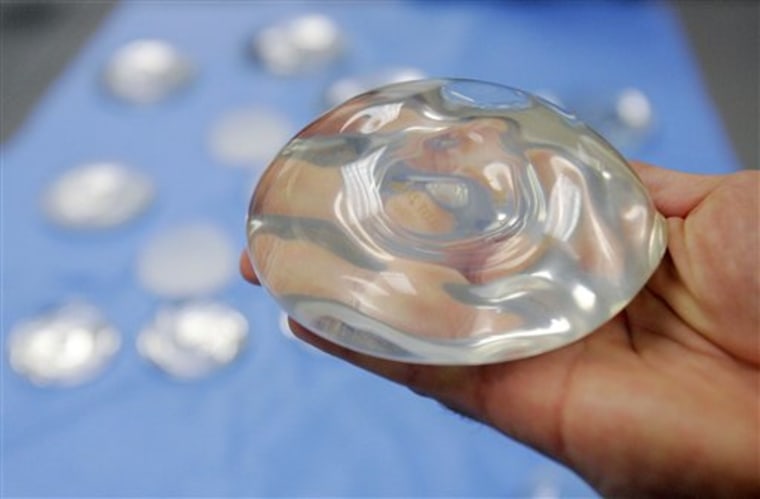 In this Dec. 11, 2006 file photo, a silicone gel breast implant is shown at Mentor Corp., a subsidiary of Johnson & Johnson, in Irving, Texas. 